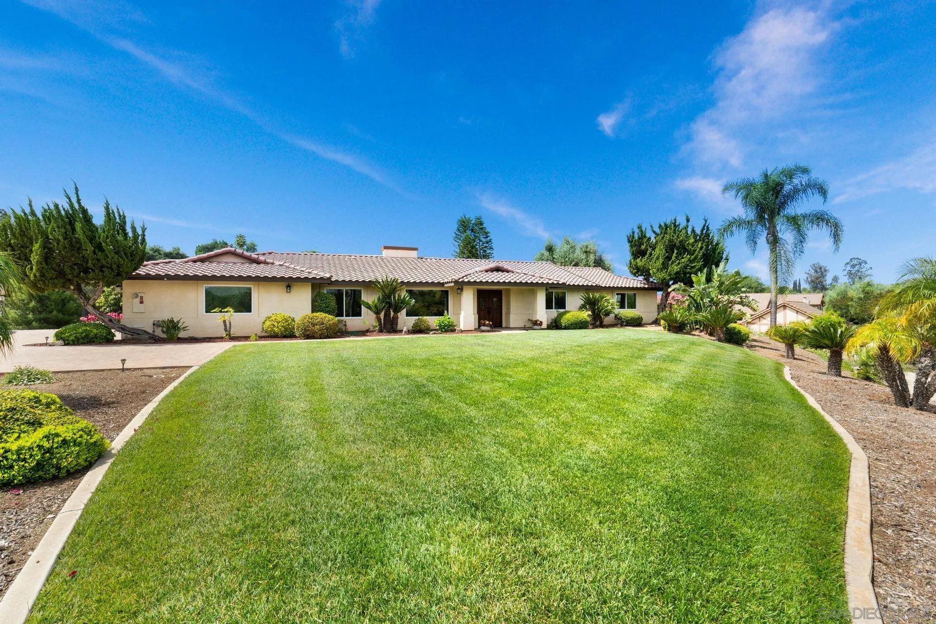 1009 Summit Trail Escondido, CA 92025 - Photo 39 of 59 a front view of a house with a yard
