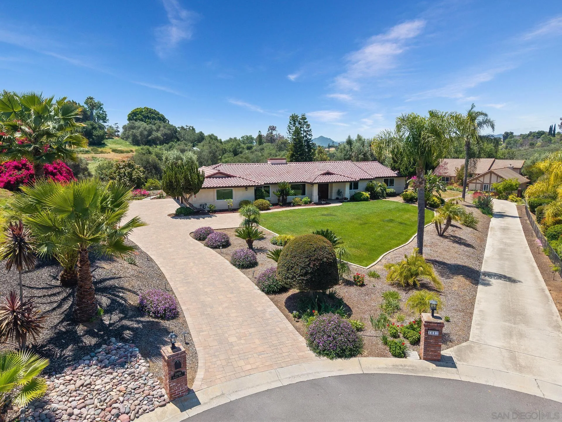 1009 Summit Trail Escondido, CA 92025 - Photo 59 of 59 a view of a backyard with plants and patio