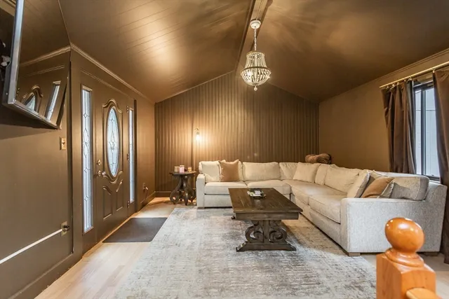 a living room with furniture and a rug