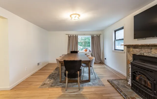 a view of a dining room with furniture window and wooden floor