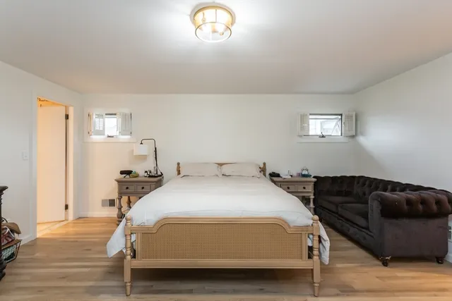 a bedroom with a bed and a couch