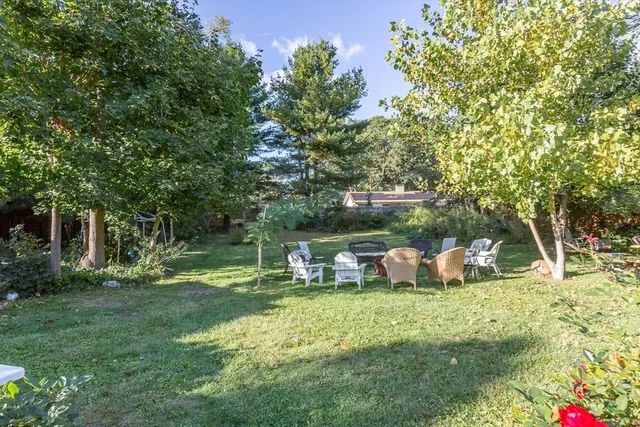 a view of a house with a yard porch and sitting area