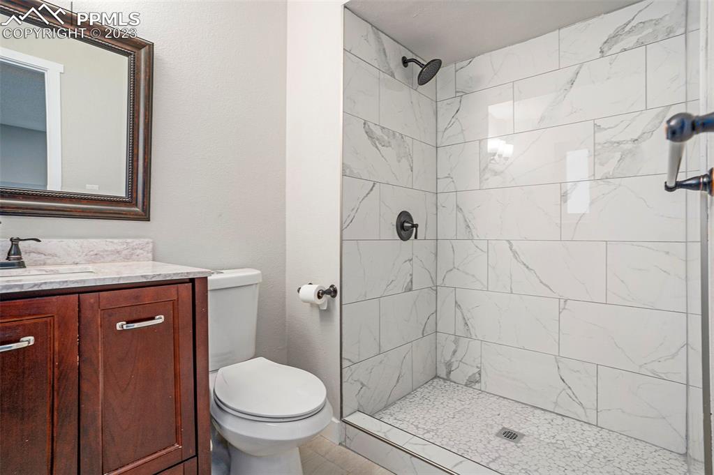 4506 Ridgecrest Drive Colorado Springs, CO 80918 - Photo 13 of 29 a bathroom with a sink a toilet and shower