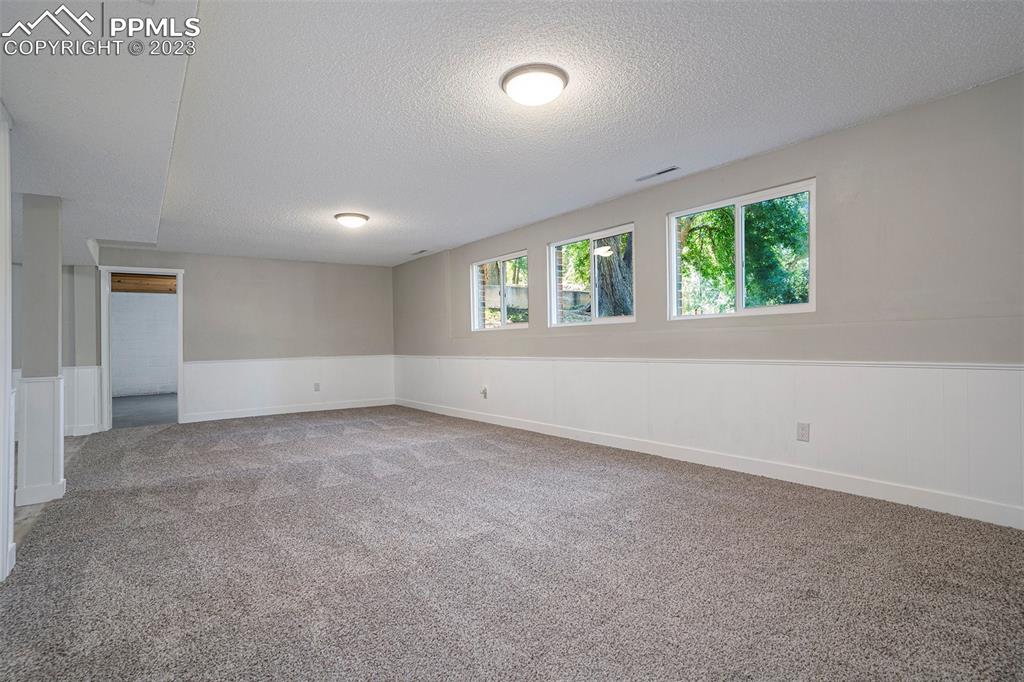 4506 Ridgecrest Drive Colorado Springs, CO 80918 - Photo 18 of 29 an empty room with windows