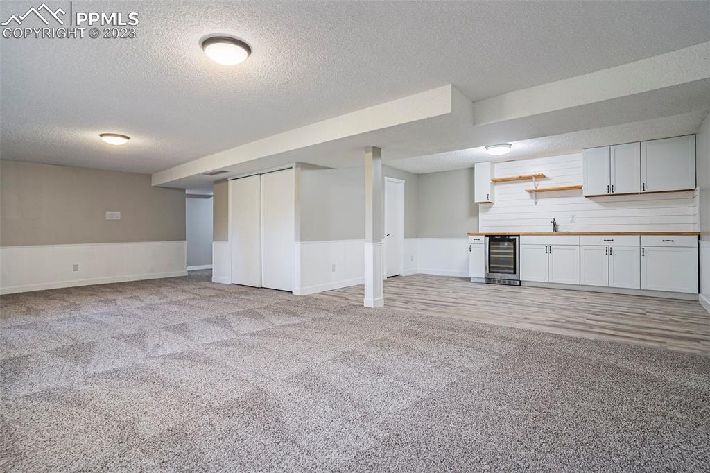4506 Ridgecrest Drive Colorado Springs, CO 80918 - Photo 19 of 29 an empty room with cabinet and mirrors