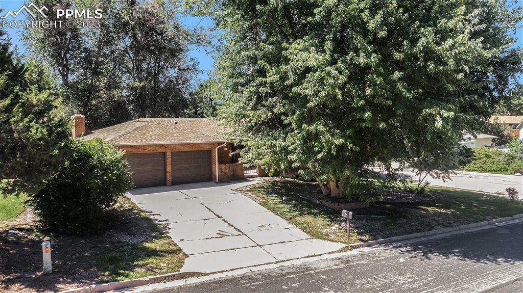 4506 Ridgecrest Drive Colorado Springs, CO 80918 - Photo 2 of 29 a front view of a house with a yard
