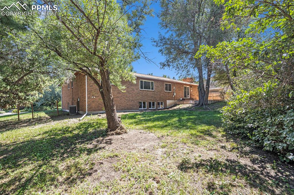 4506 Ridgecrest Drive Colorado Springs, CO 80918 - Photo 25 of 29 a view of a house with a yard