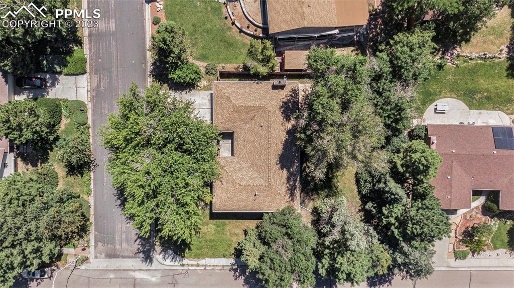 4506 Ridgecrest Drive Colorado Springs, CO 80918 - Photo 27 of 29 an aerial view of a house with a yard and garden