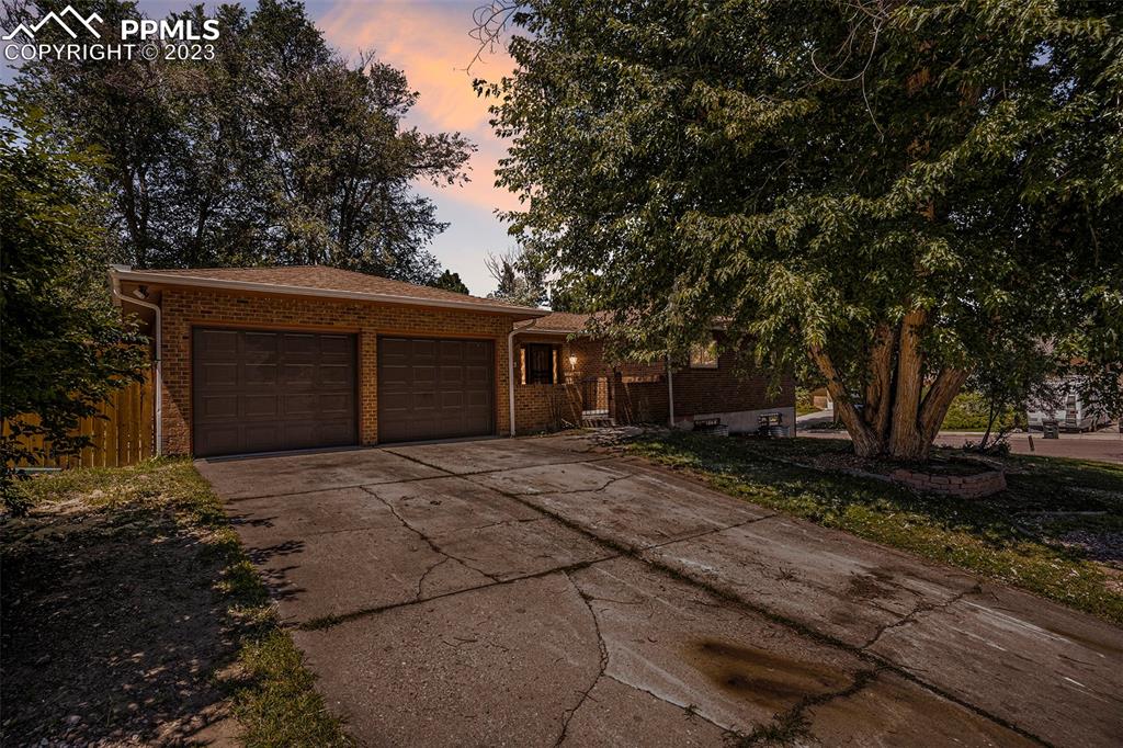 4506 Ridgecrest Drive Colorado Springs, CO 80918 - Photo 5 of 29 a house with trees in the background