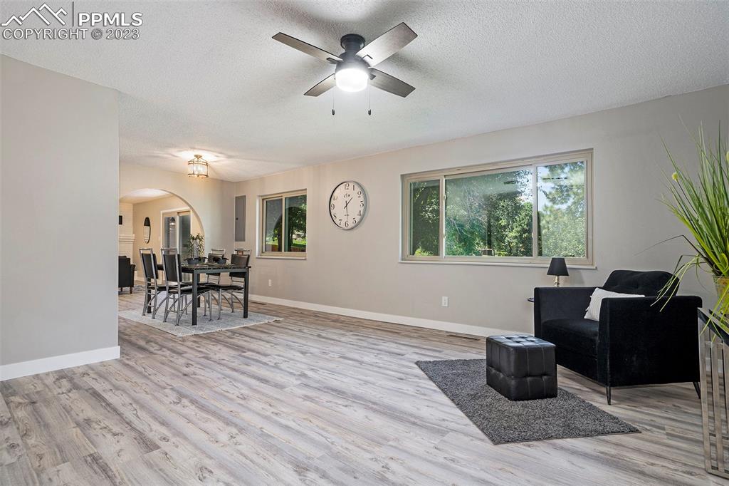 4506 Ridgecrest Drive Colorado Springs, CO 80918 - Photo 7 of 29 a living room with furniture and a large window