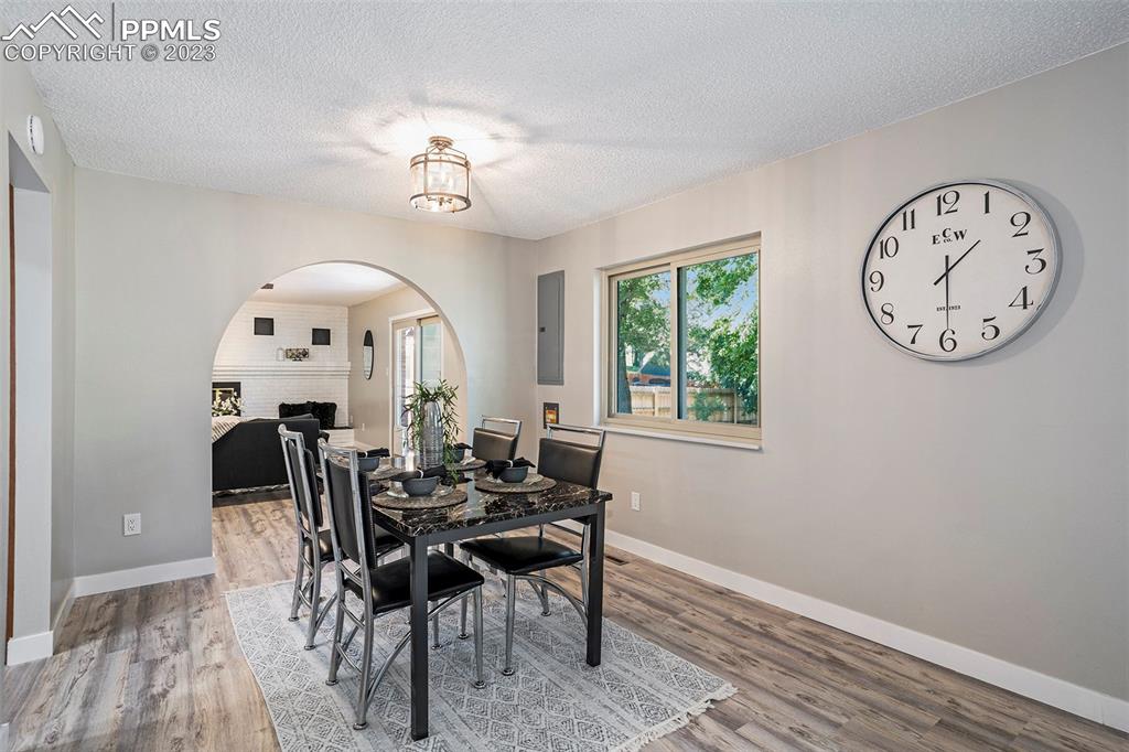 4506 Ridgecrest Drive Colorado Springs, CO 80918 - Photo 10 of 29 a view of a dining room with furniture and a chandelier