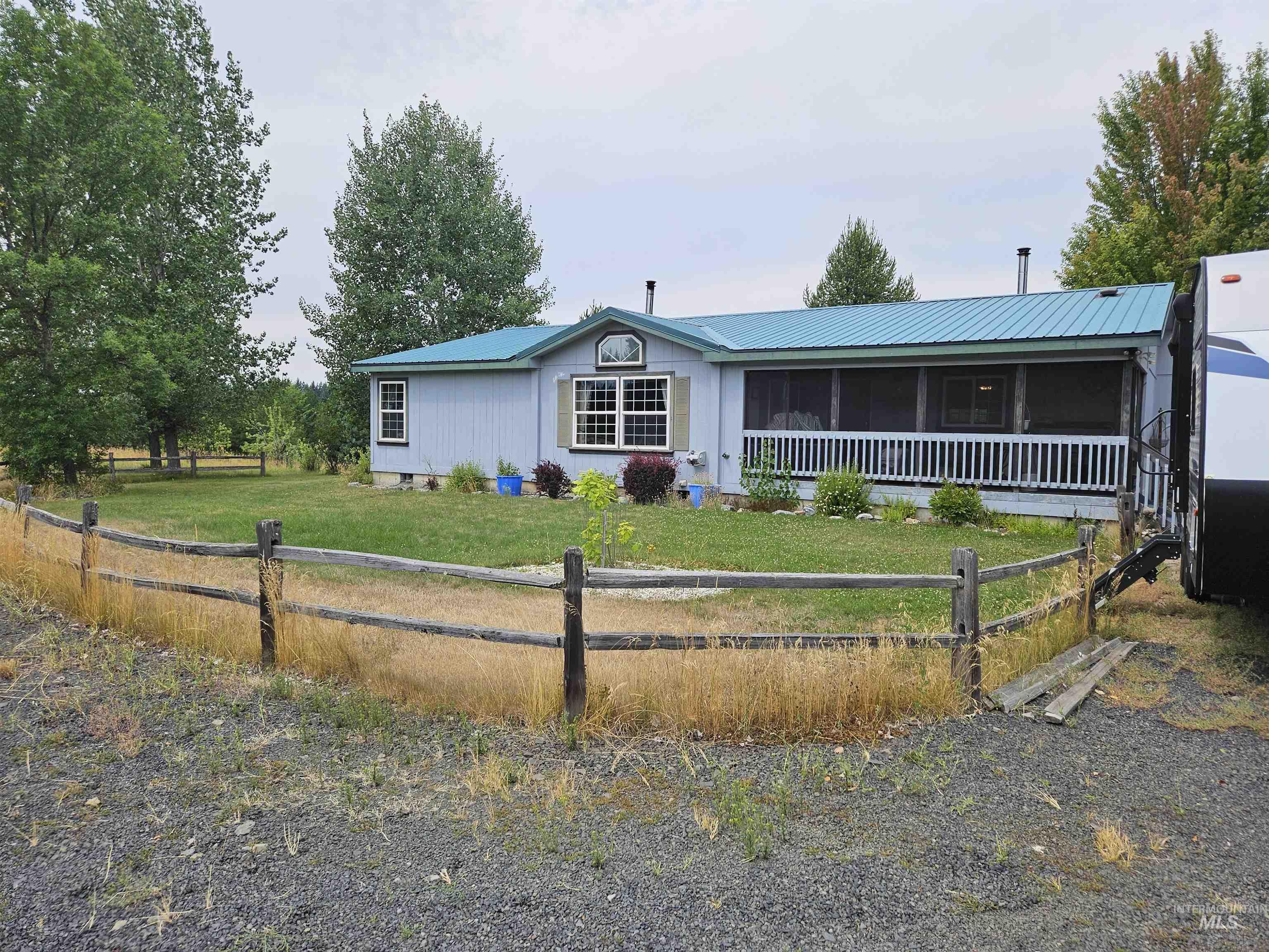 Ranch-style house featuring a metal roof, crawl space, and a sunroom