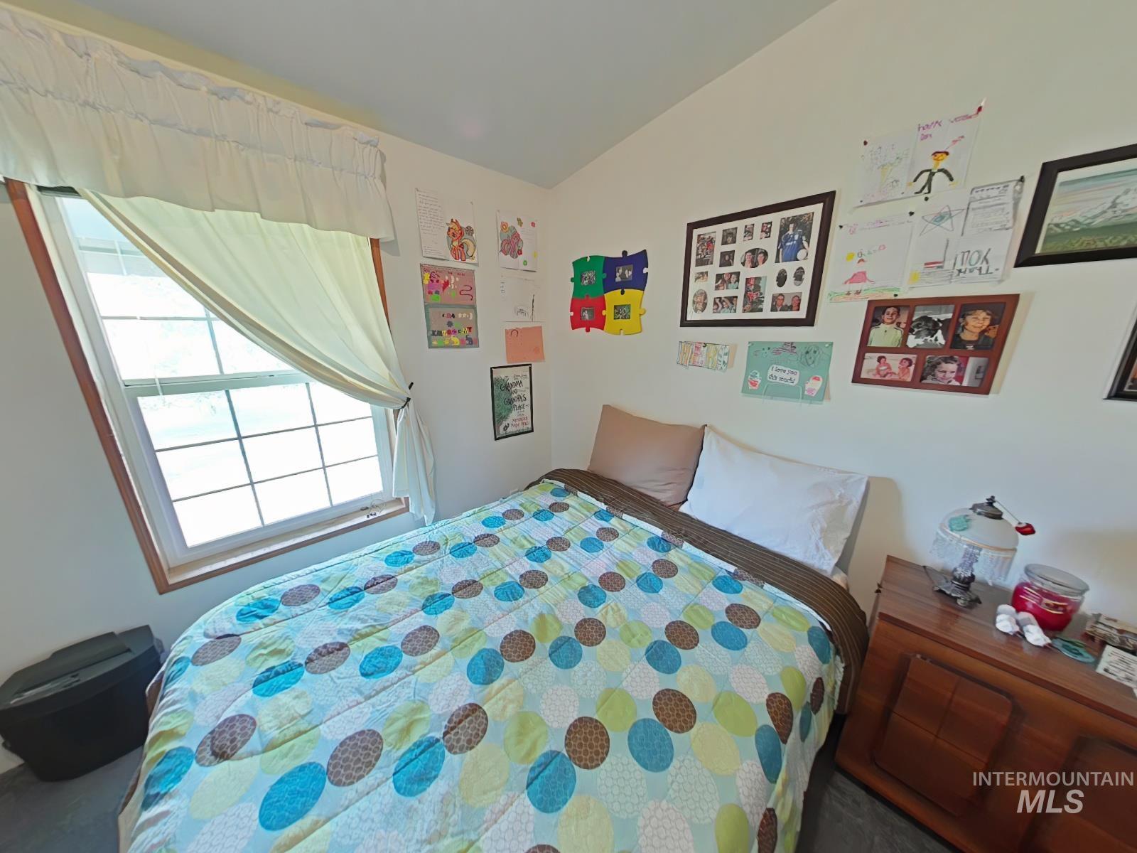232 Lackey Road Weippe, ID 83553 - Photo 14 of 33 Bedroom featuring vaulted ceiling