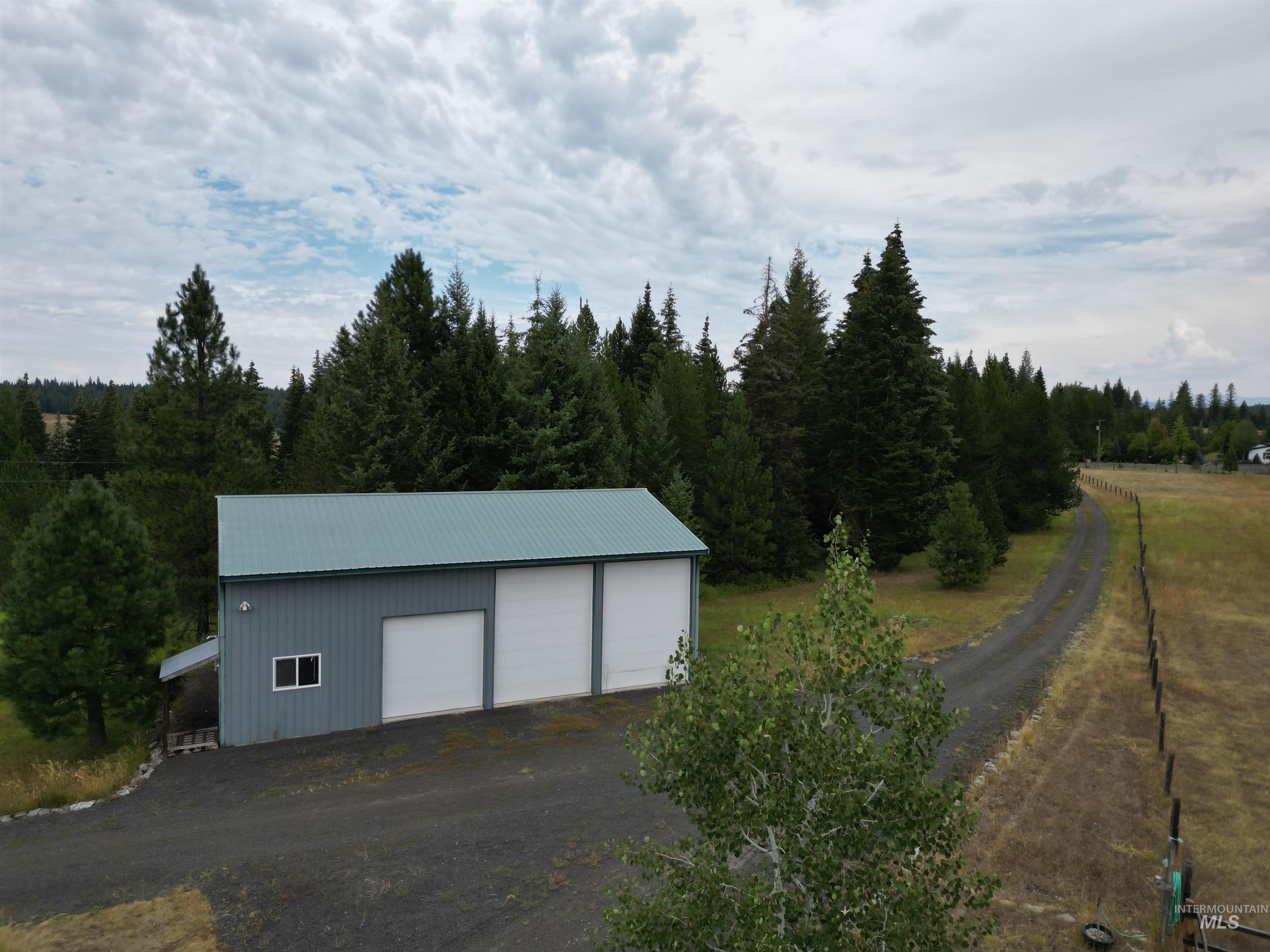 232 Lackey Road Weippe, ID 83553 - Photo 16 of 33 View of outbuilding featuring a forest view