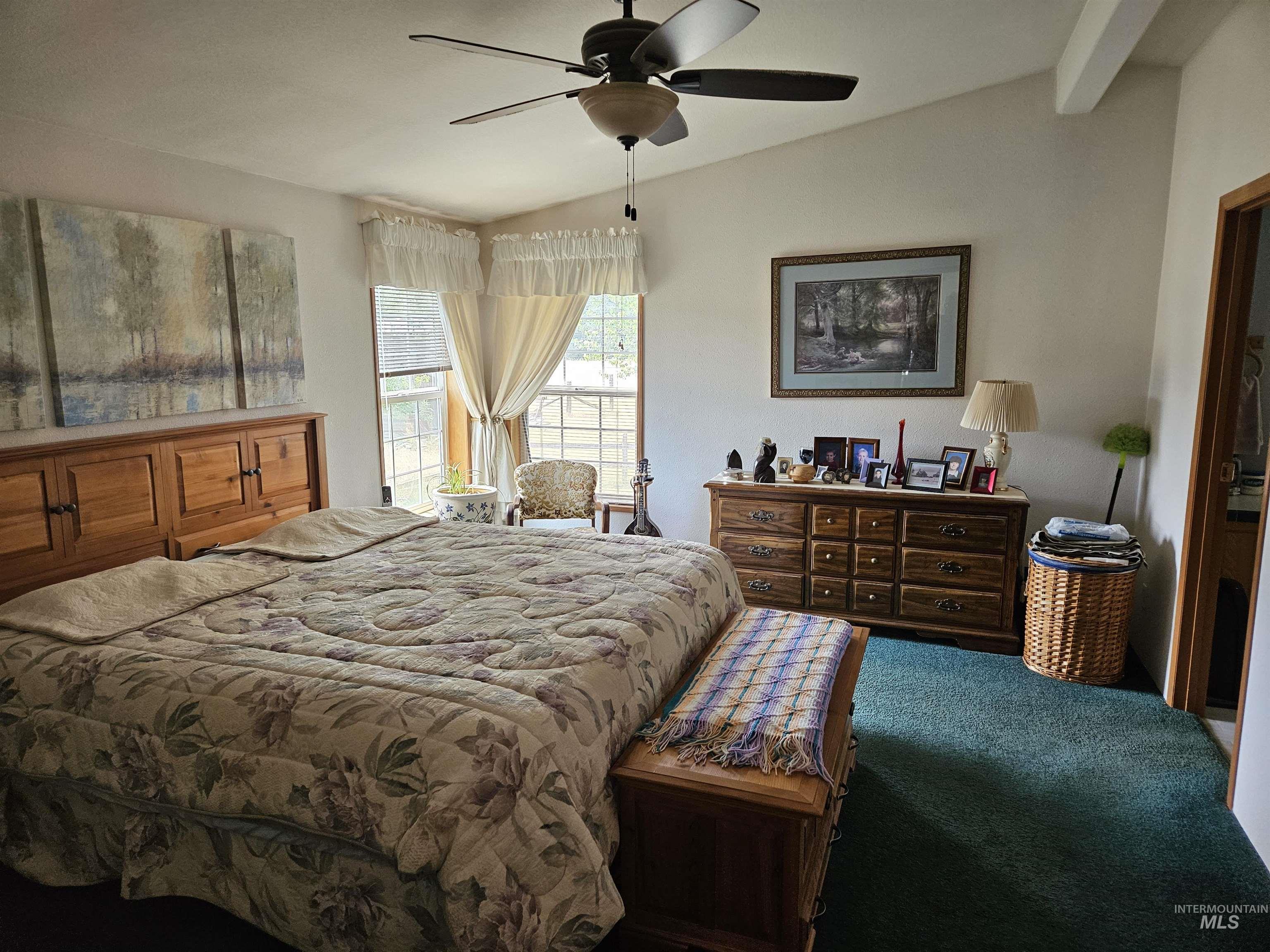 232 Lackey Road Weippe, ID 83553 - Photo 9 of 33 Bedroom with lofted ceiling and ceiling fan
