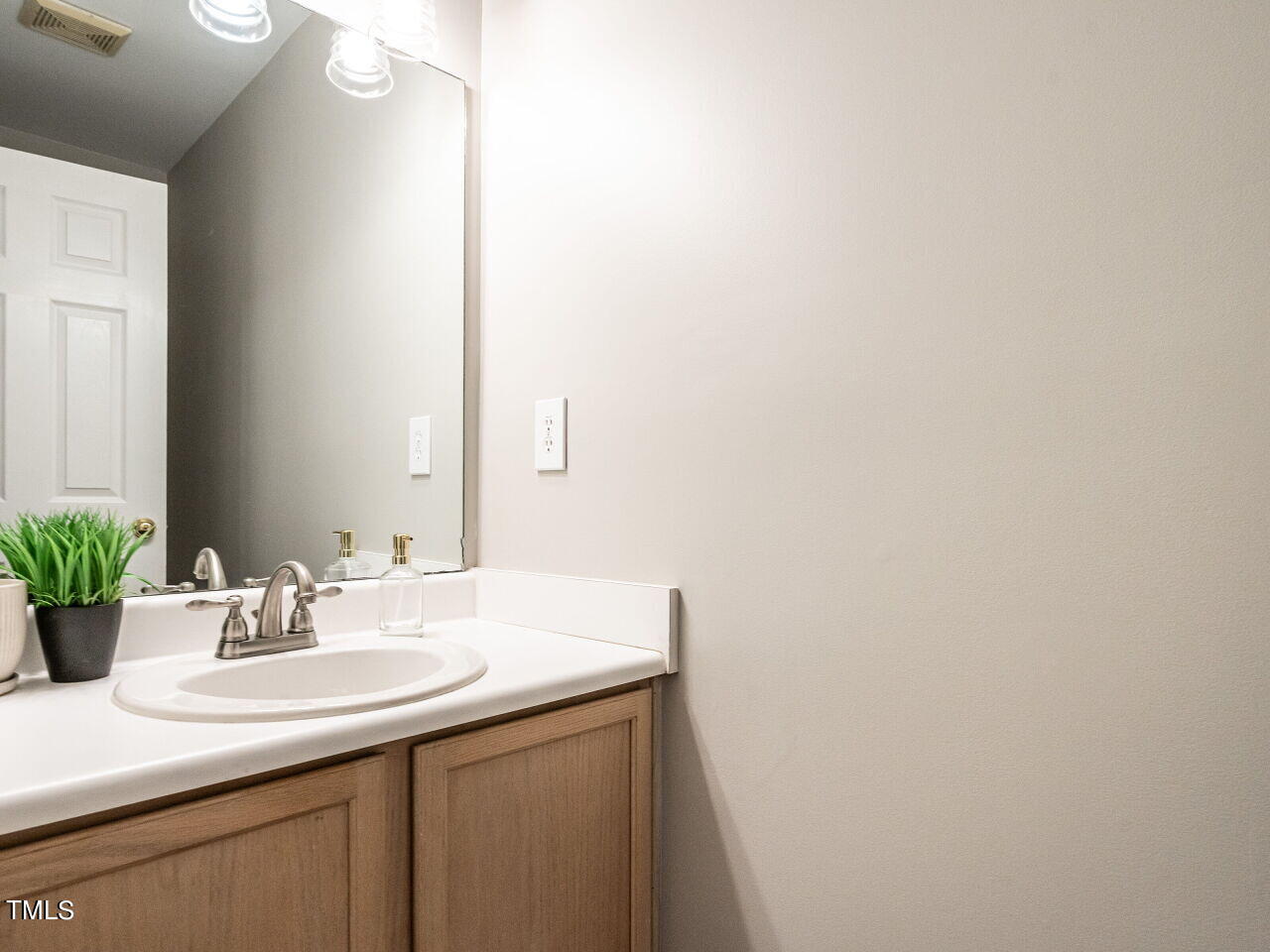 3 Madeira Court Durham, NC 27713 - Photo 14 of 27 a bathroom with a sink and a mirror