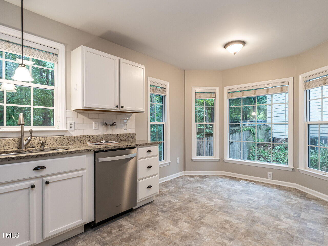 3 Madeira Court Durham, NC 27713 - Photo 9 of 27 a kitchen with granite countertop a sink and a stove