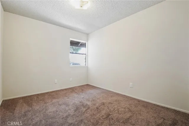 an empty room with a empty space and window