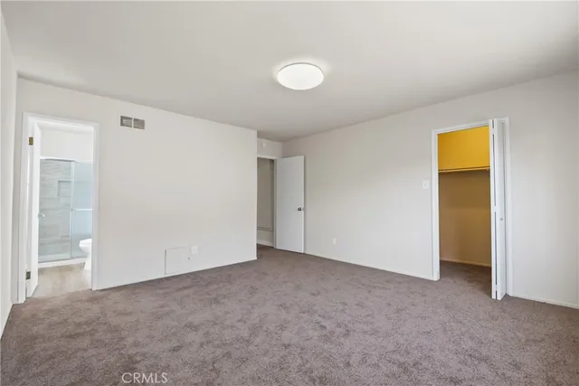 an empty room with a bathroom