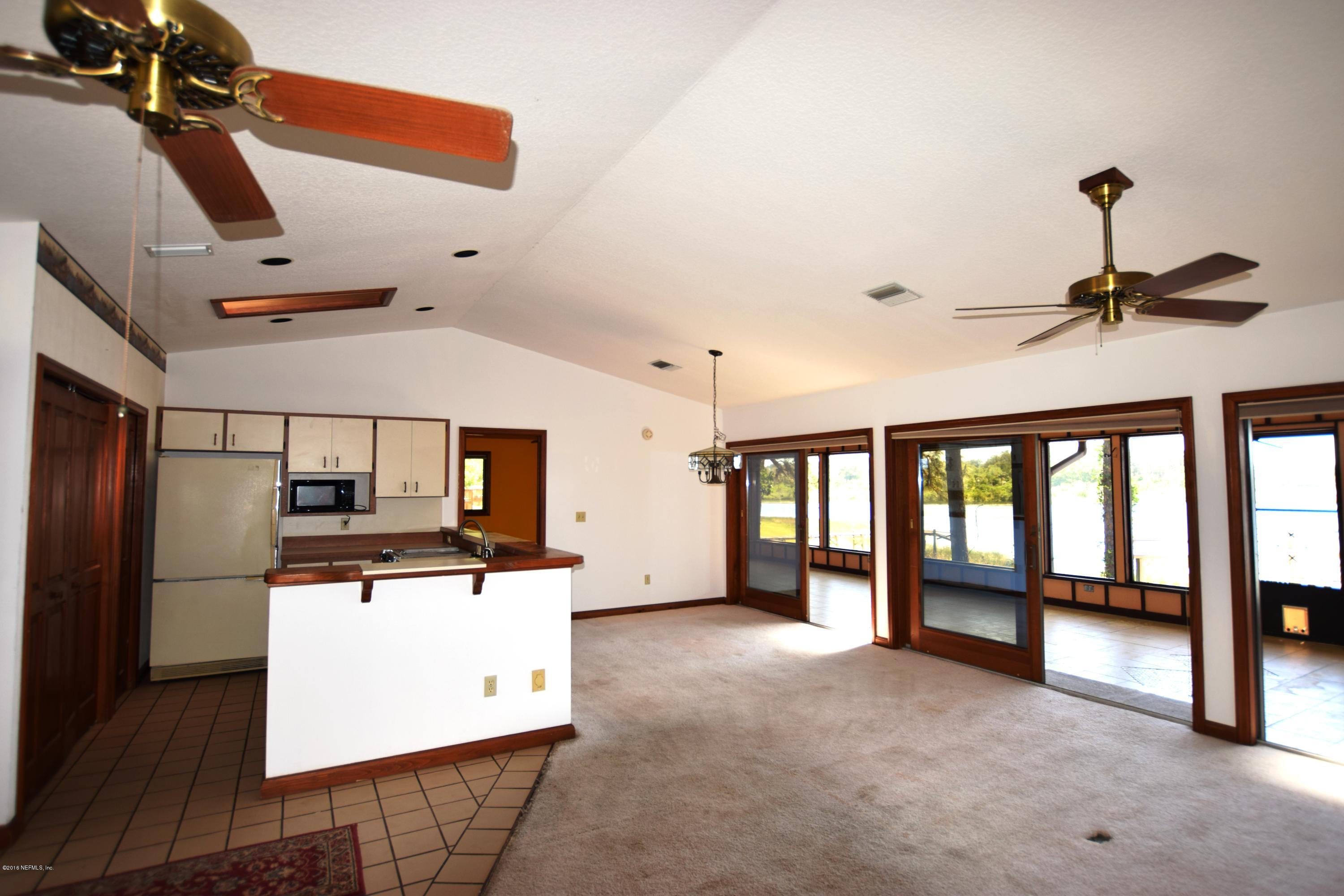 155 Silver Pond Road Crescent City, FL 32112 - Photo 7 of 27 kitchen and living room
