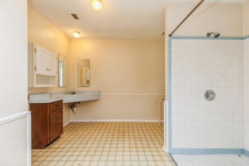 3369 Auburn Road Crestview, FL 32539 - Photo 24 of 33 a bathroom with a sink a toilet and shower
