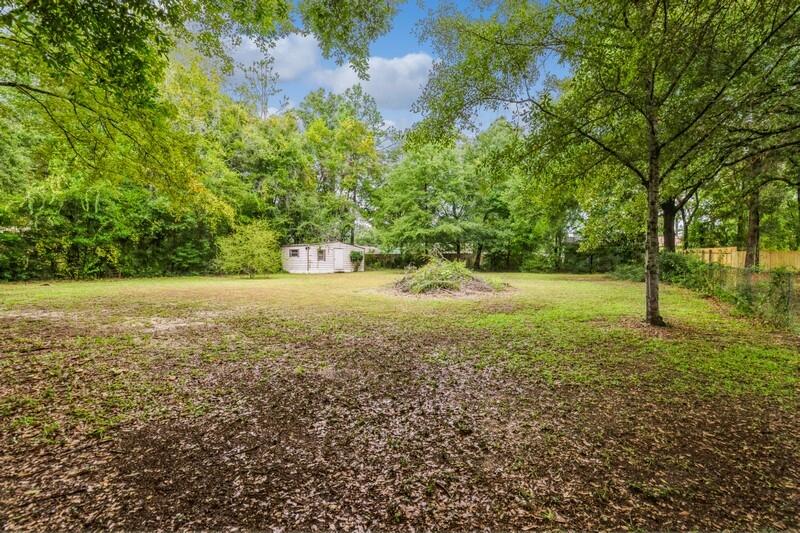 3369 Auburn Road Crestview, FL 32539 - Photo 32 of 33 a view of a field with trees in the background
