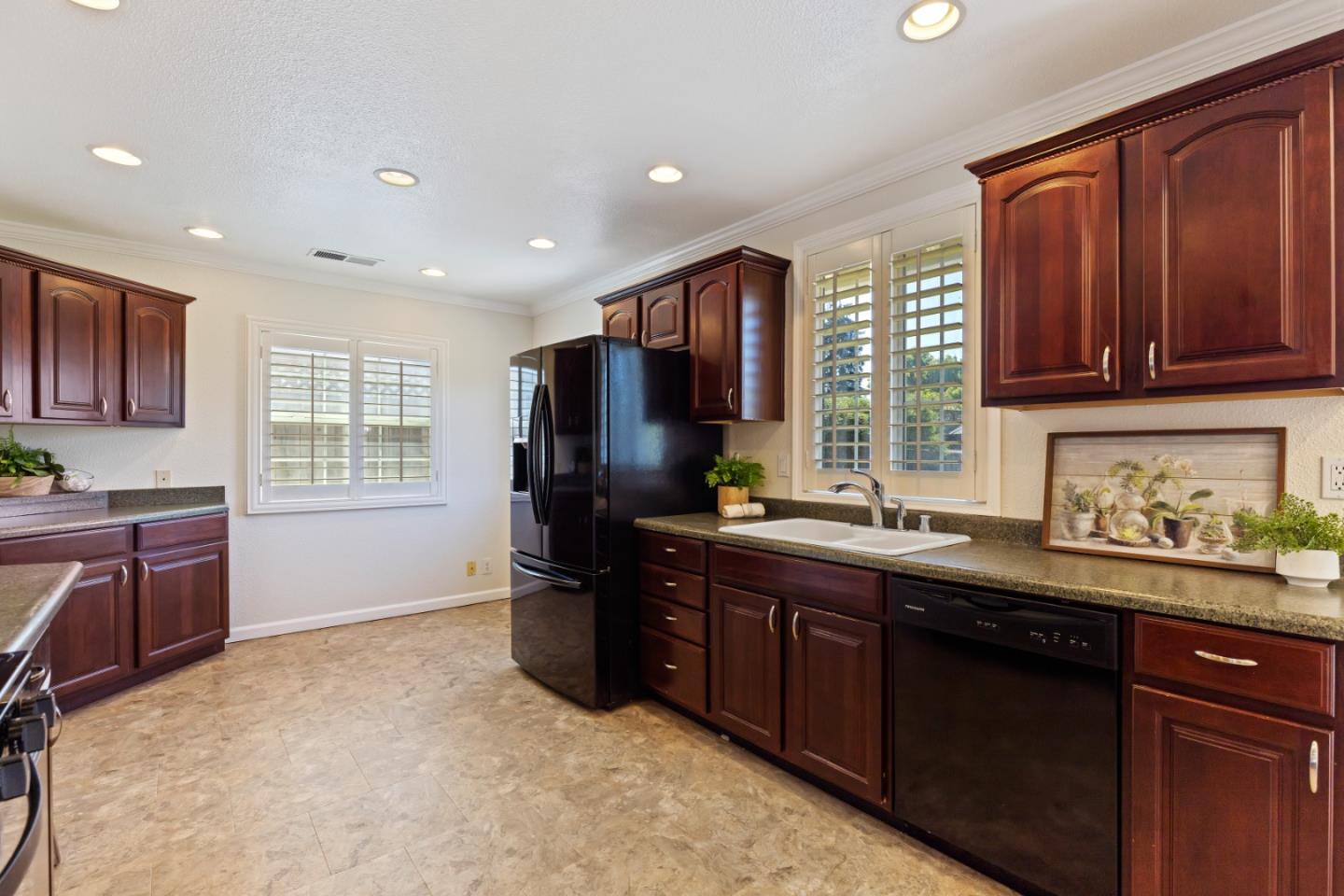 23131 Nevada Road Hayward, CA 94541 - Photo 15 of 28 a kitchen with granite countertop stainless steel appliances a refrigerator sink and microwave