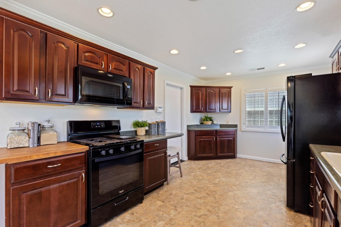 23131 Nevada Road Hayward, CA 94541 - Photo 16 of 28 a kitchen with stainless steel appliances granite countertop a stove refrigerator and a microwave
