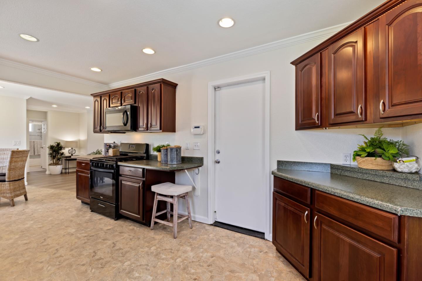 23131 Nevada Road Hayward, CA 94541 - Photo 17 of 28 a kitchen with stainless steel appliances granite countertop sink stove and cabinets