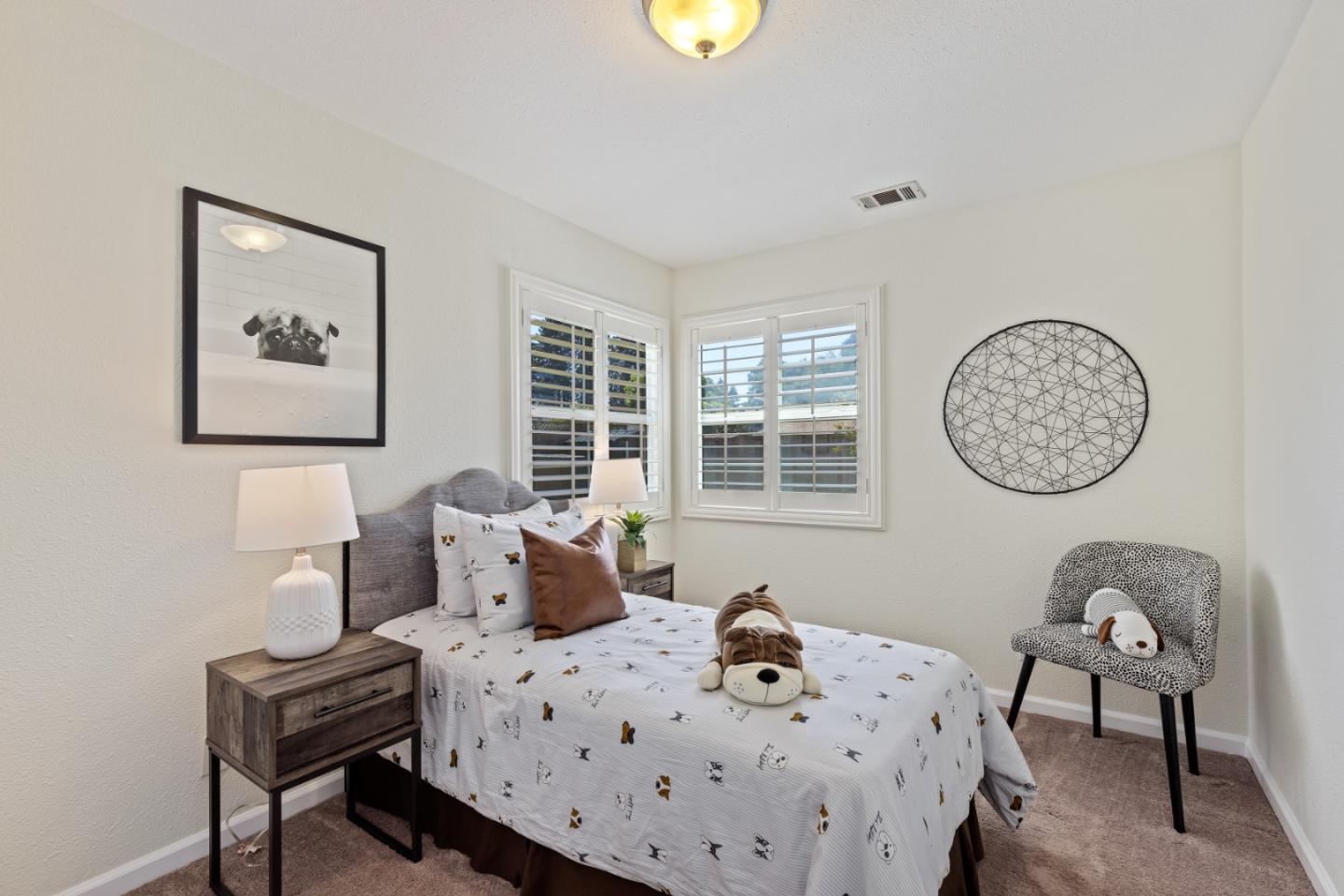 23131 Nevada Road Hayward, CA 94541 - Photo 20 of 28 a bedroom with a bed a dresser and chair