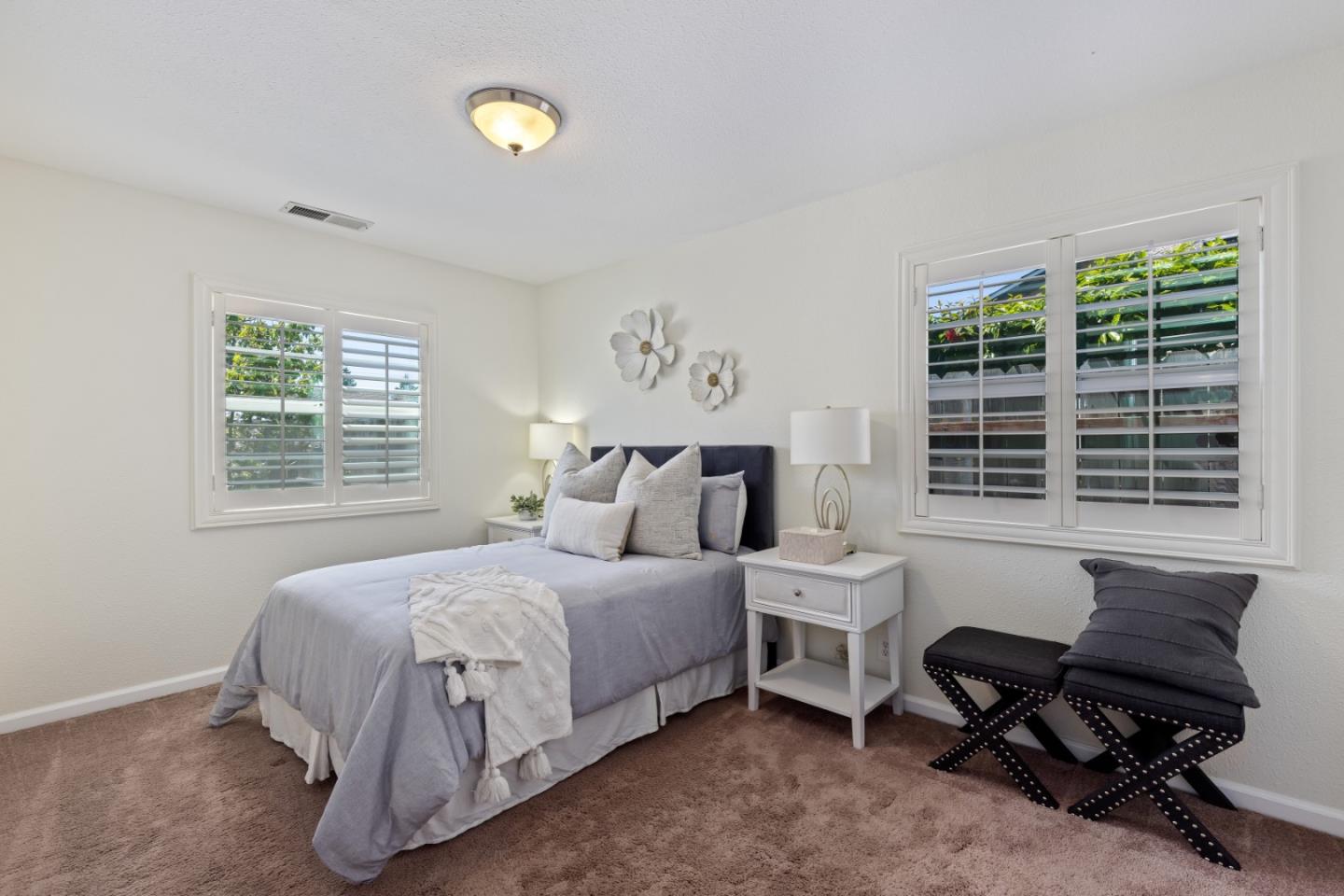 23131 Nevada Road Hayward, CA 94541 - Photo 21 of 28 a bedroom with a bed and a window