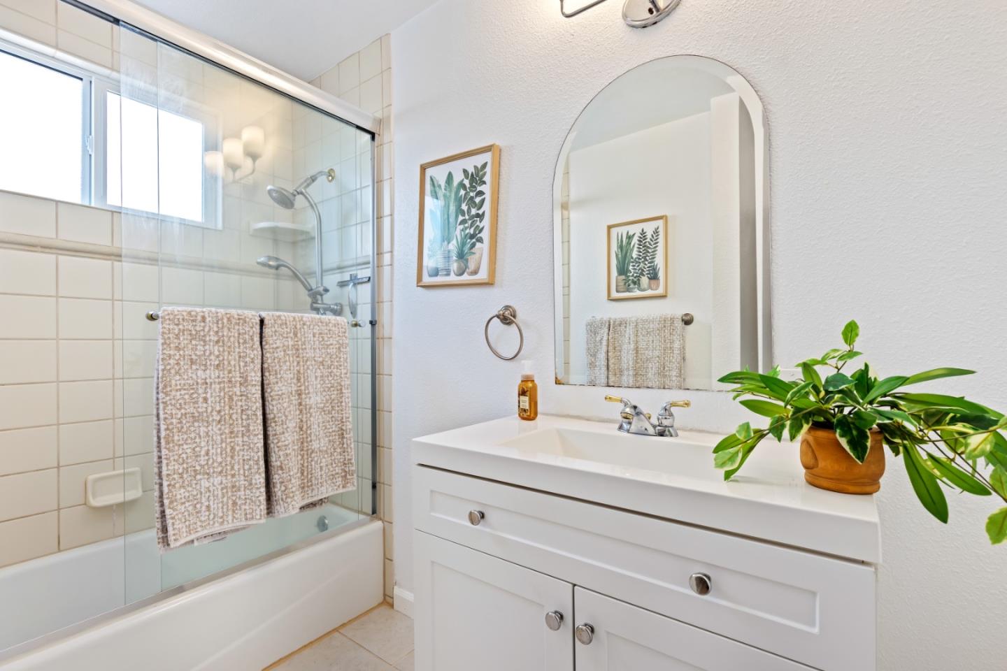 23131 Nevada Road Hayward, CA 94541 - Photo 22 of 28 a bathroom with a sink a mirror and a bathtub