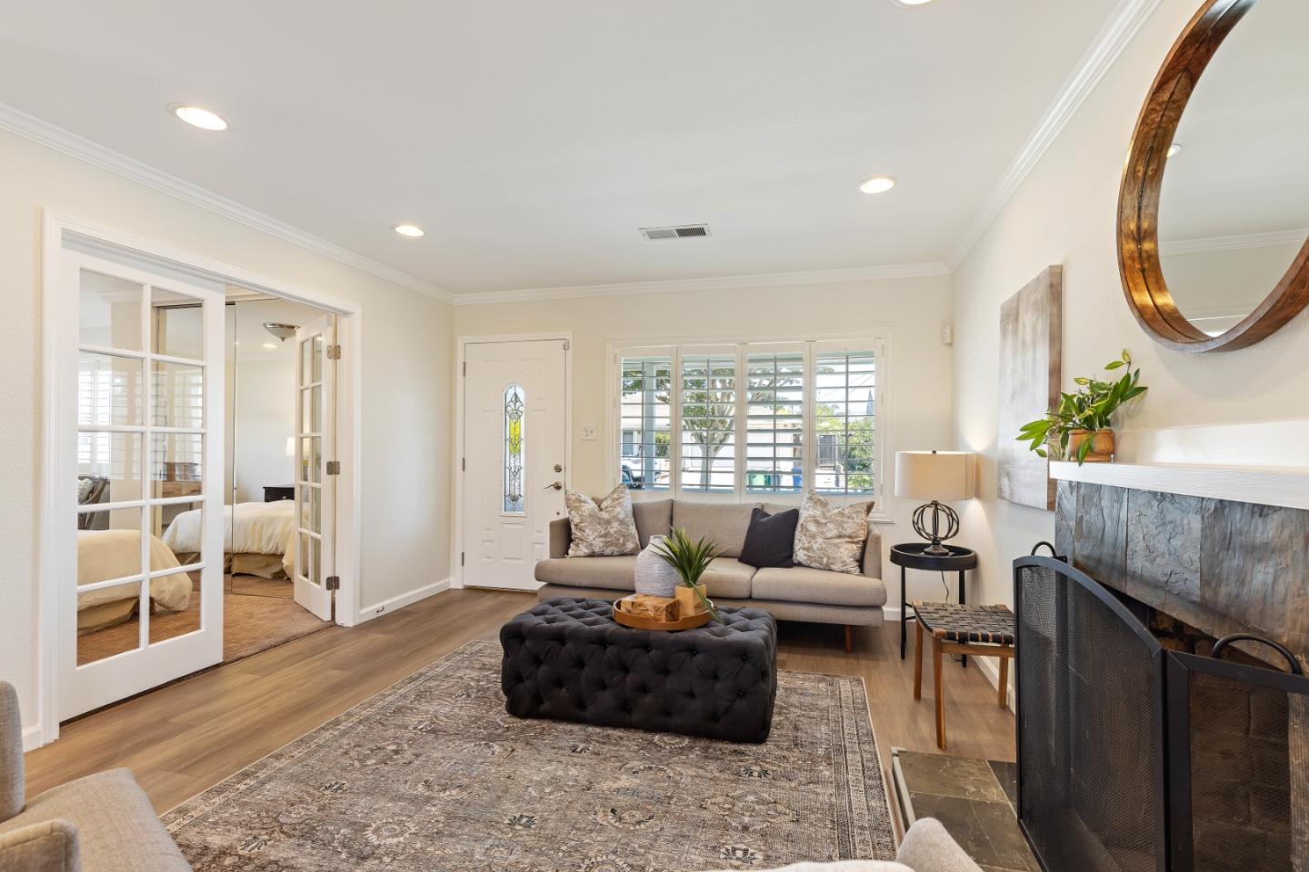 23131 Nevada Road Hayward, CA 94541 - Photo 8 of 28 a living room with furniture a rug a fireplace and a table