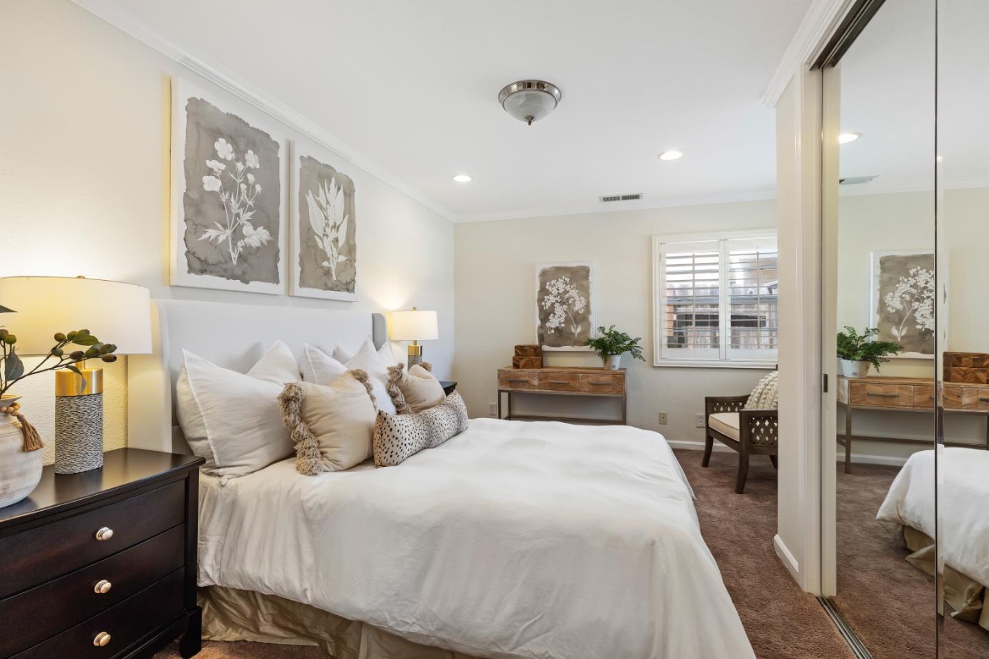 23131 Nevada Road Hayward, CA 94541 - Photo 10 of 28 a bedroom with a large bed and a chandelier