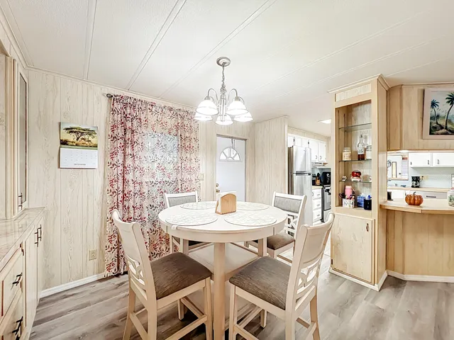 a bedroom with a bed and a table