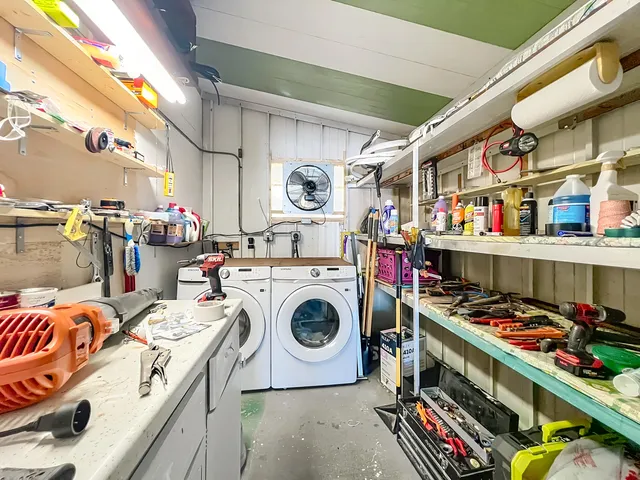 a view of a chairs and table in a backyard