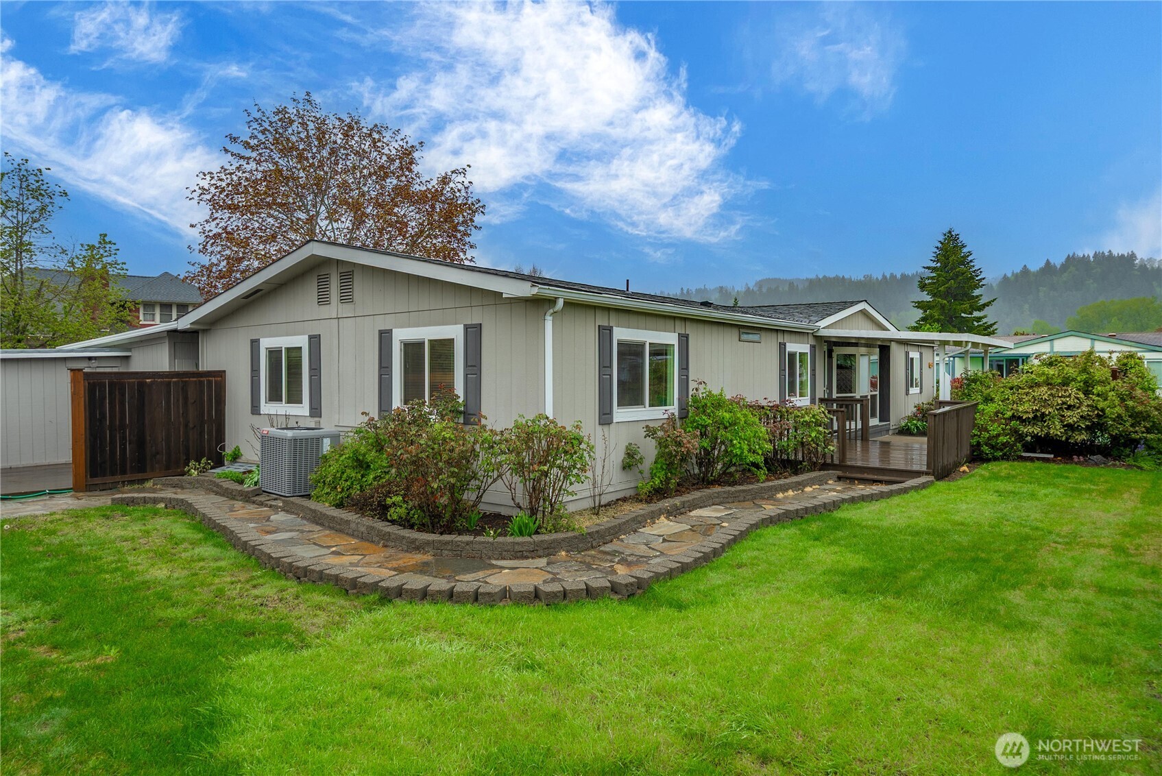 a view of house with a yard