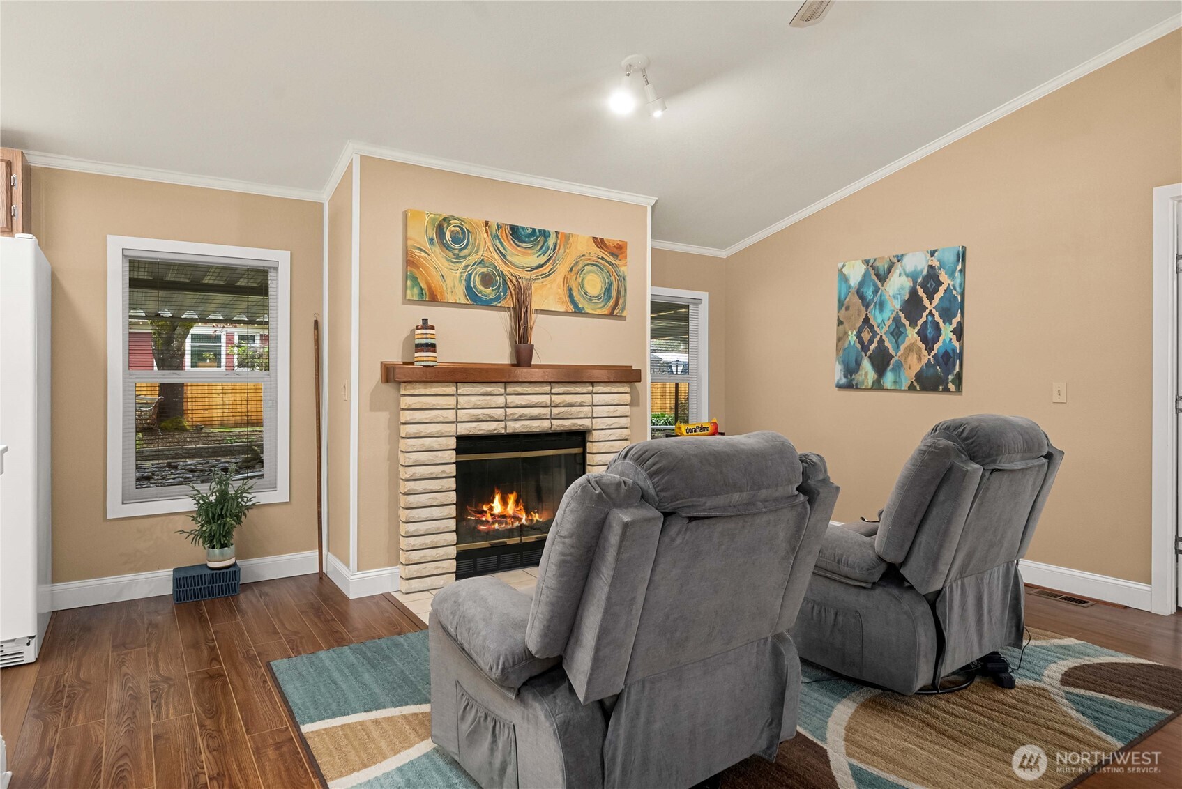 836 Harman Way South, Unit 62 Orting, WA 98360 - Photo 11 of 40 a living room with furniture and a fireplace