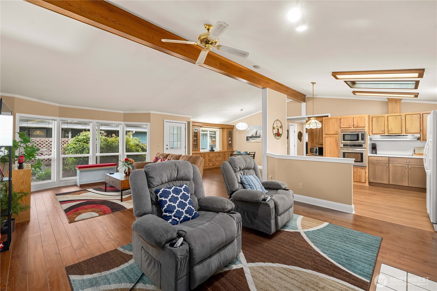 836 Harman Way South, Unit 62 Orting, WA 98360 - Photo 12 of 40 a living room with furniture and a large window