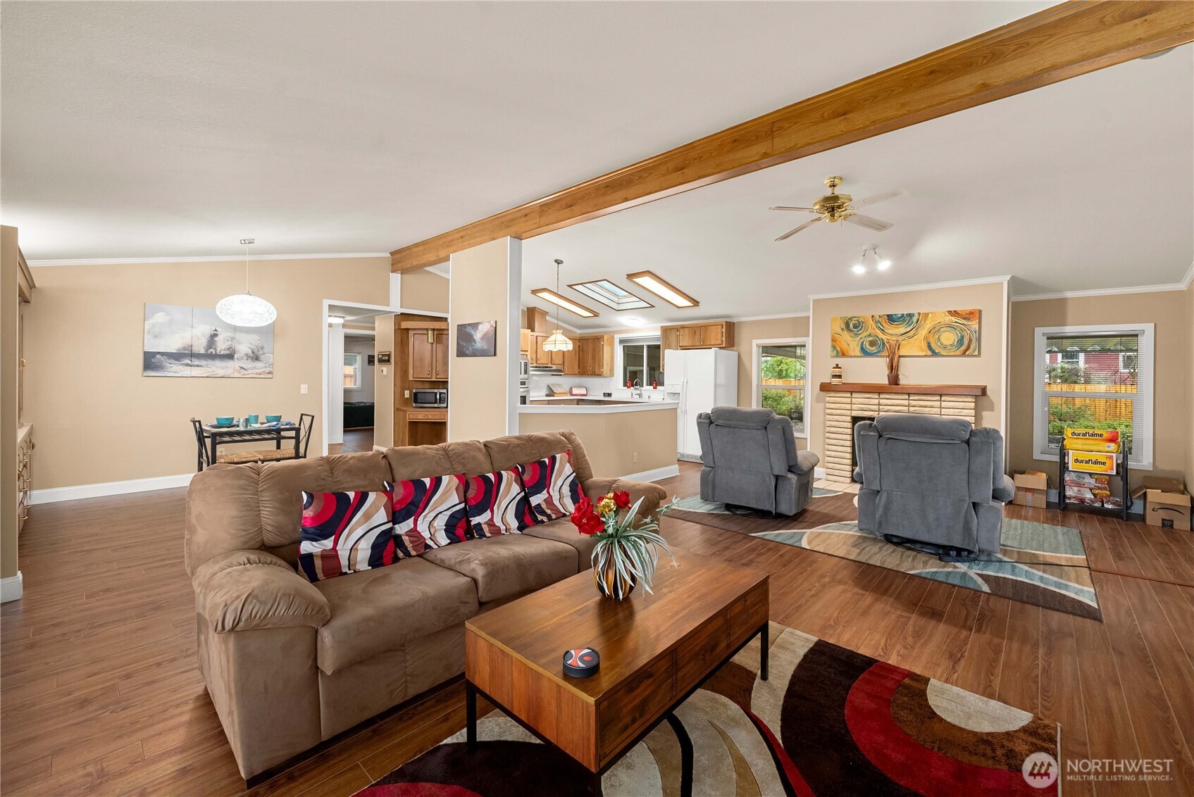 836 Harman Way South, Unit 62 Orting, WA 98360 - Photo 13 of 40 a living room with furniture kitchen view and a large window