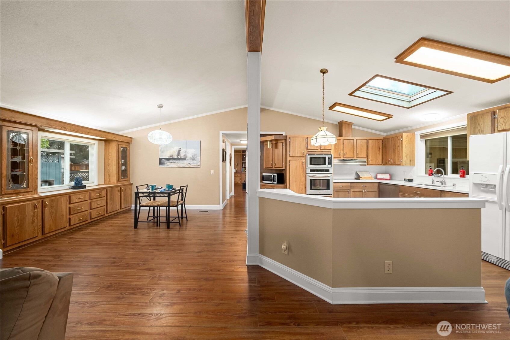 836 Harman Way South, Unit 62 Orting, WA 98360 - Photo 14 of 40 a living room with furniture and kitchen view