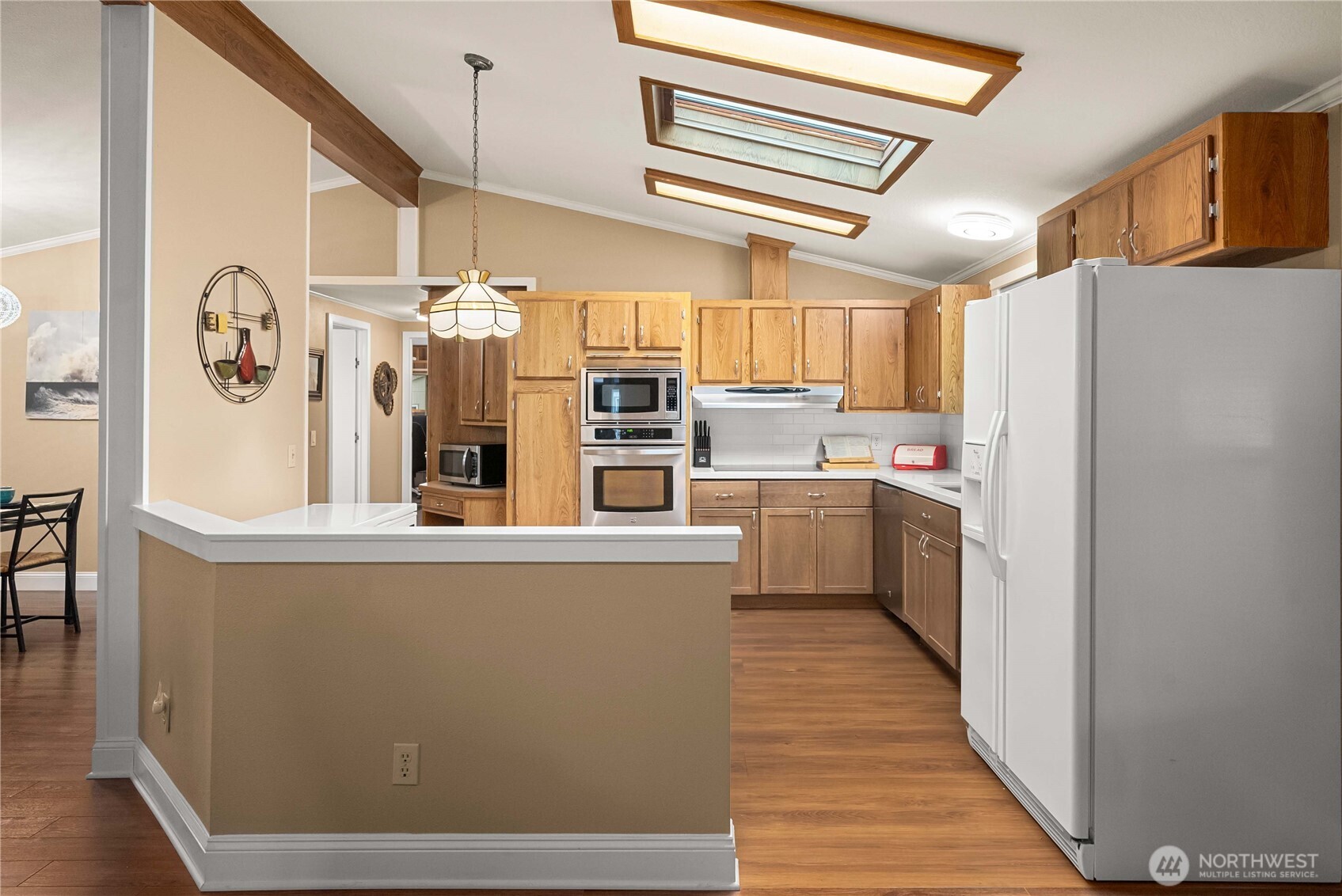 836 Harman Way South, Unit 62 Orting, WA 98360 - Photo 16 of 40 a kitchen with refrigerator and window