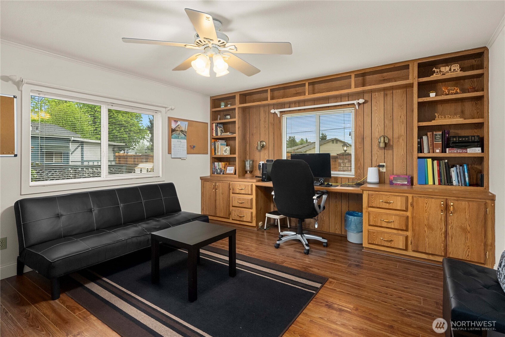 836 Harman Way South, Unit 62 Orting, WA 98360 - Photo 19 of 40 a work room with furniture wooden floor and a window