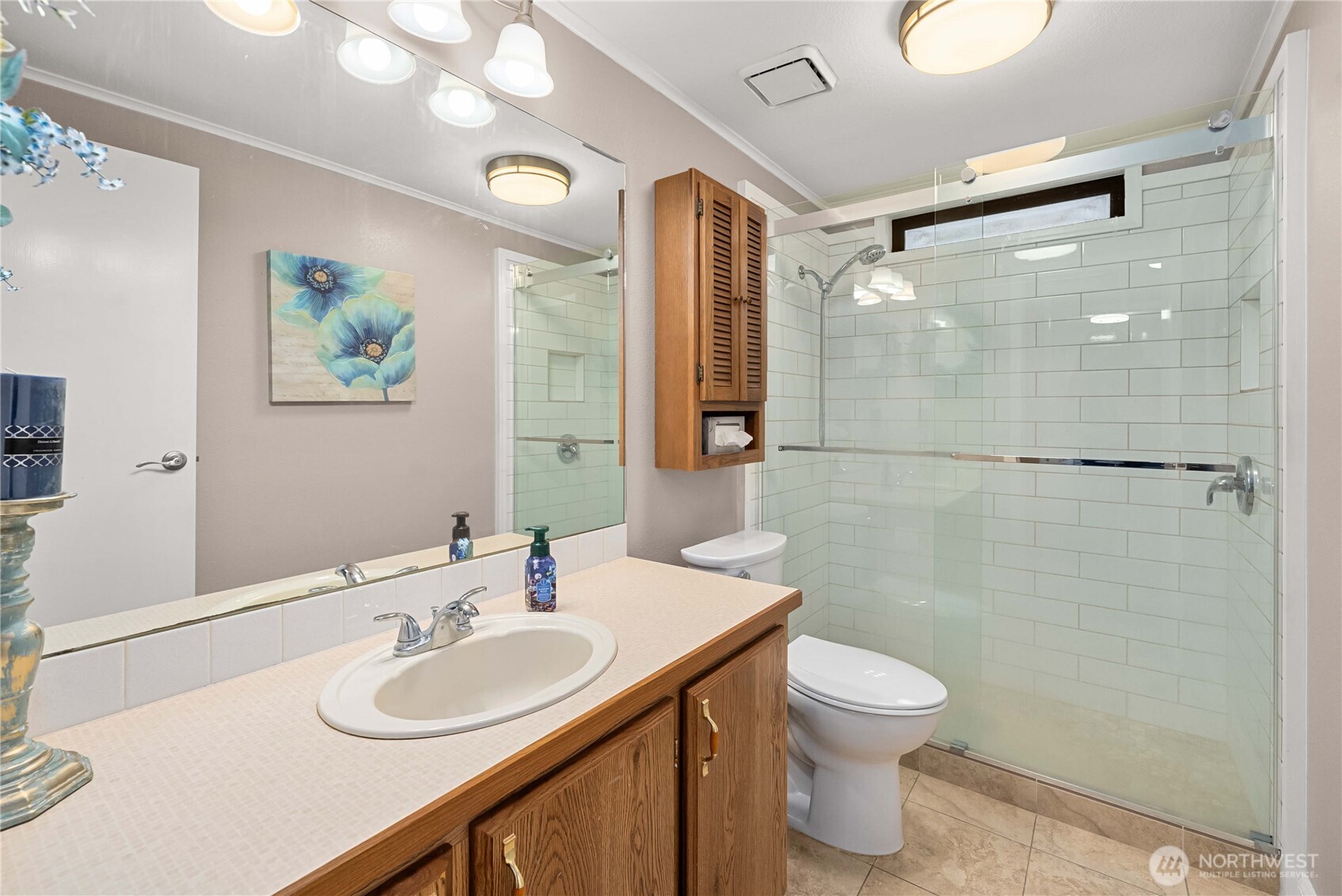 836 Harman Way South, Unit 62 Orting, WA 98360 - Photo 21 of 40 a bathroom with a sink toilet and shower