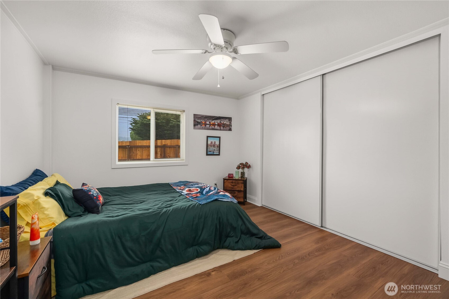 836 Harman Way South, Unit 62 Orting, WA 98360 - Photo 22 of 40 a bed room with a bed and a window