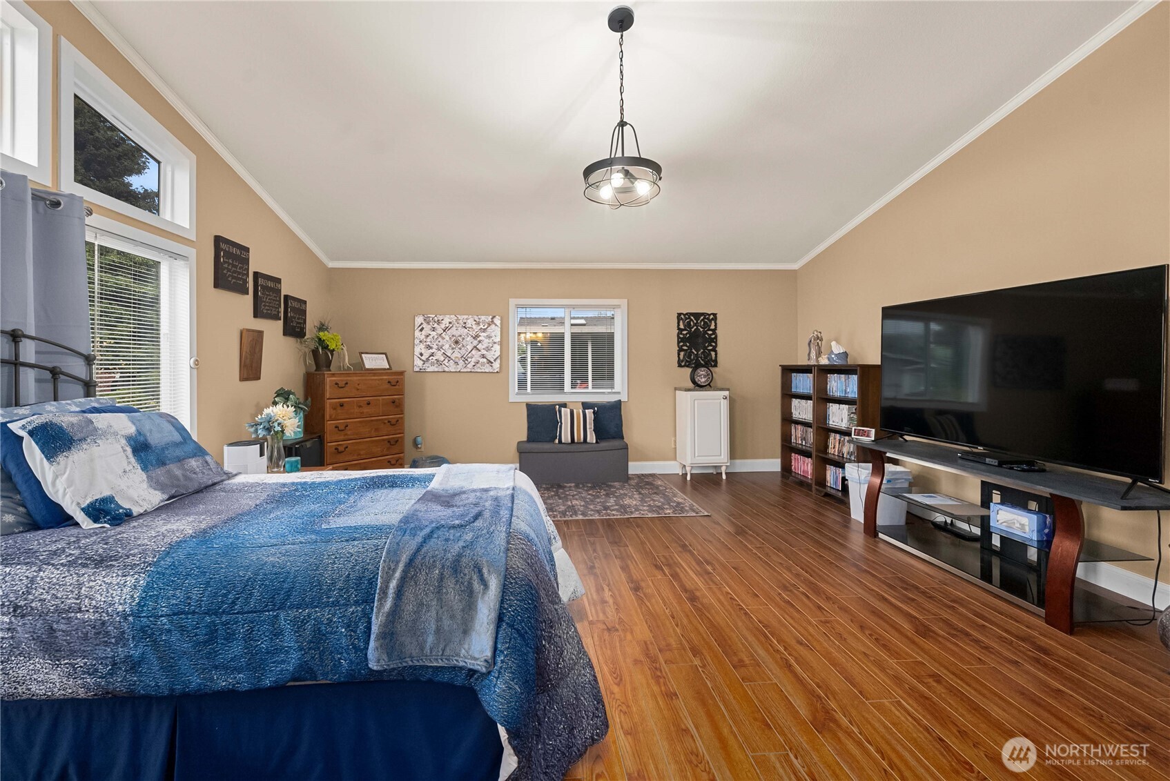 836 Harman Way South, Unit 62 Orting, WA 98360 - Photo 25 of 40 a bedroom with a bed and a flat screen tv