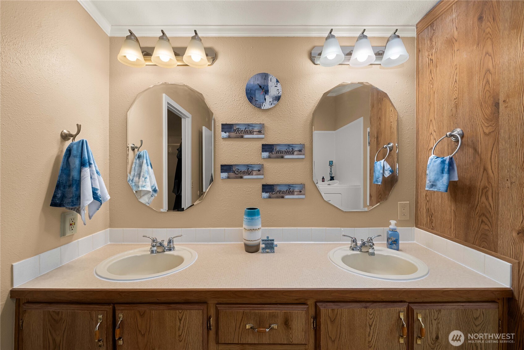 836 Harman Way South, Unit 62 Orting, WA 98360 - Photo 28 of 40 a bathroom with a double vanity sink and a mirror