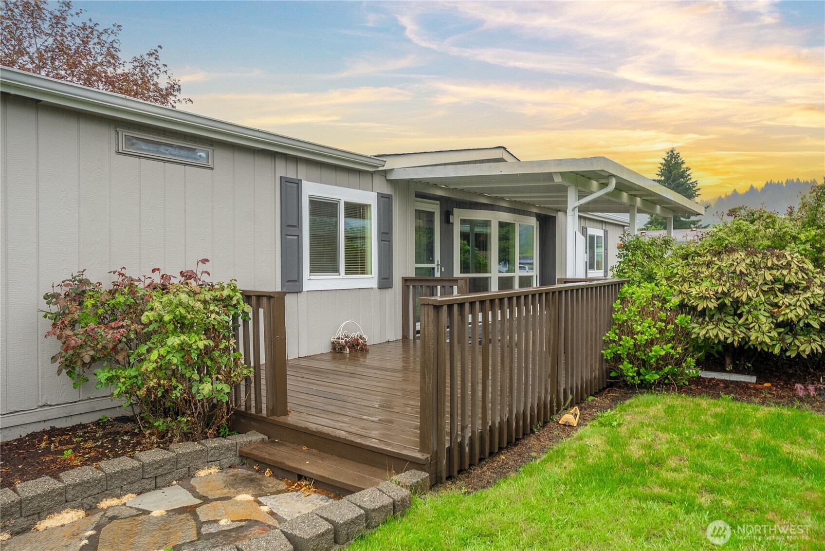 836 Harman Way South, Unit 62 Orting, WA 98360 - Photo 30 of 40 a view of a small house with wooden fence