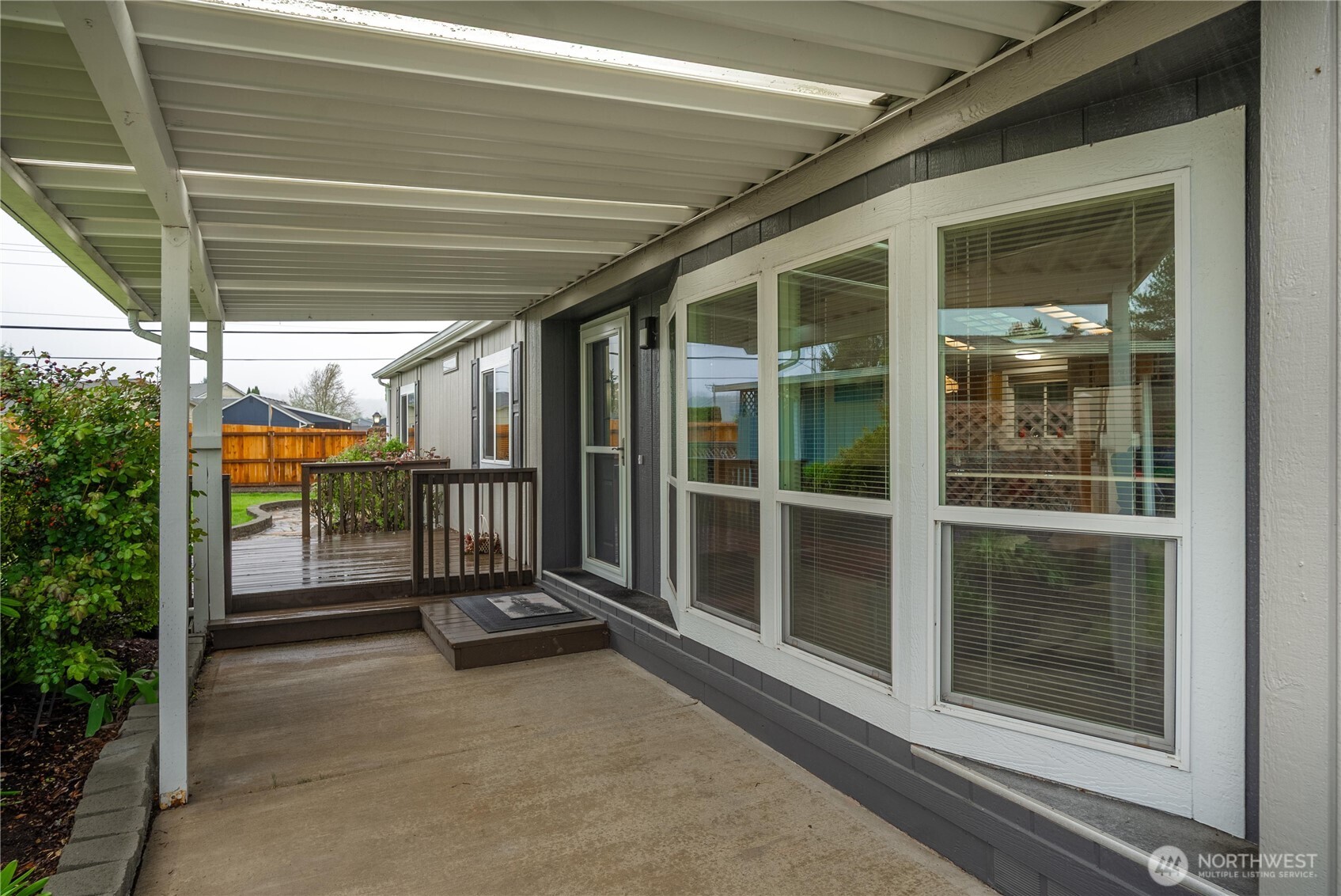 836 Harman Way South, Unit 62 Orting, WA 98360 - Photo 3 of 40 a view of a porch with a glass door