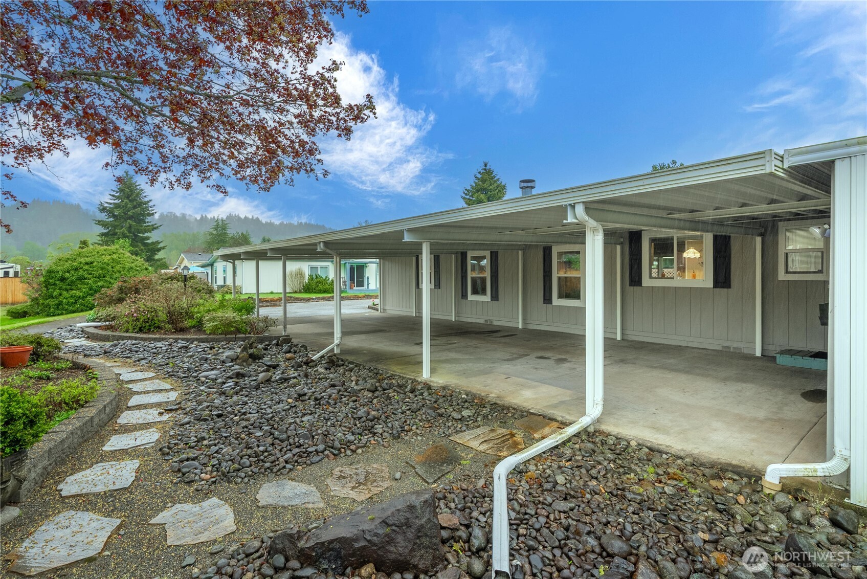 836 Harman Way South, Unit 62 Orting, WA 98360 - Photo 34 of 40 a view of a house with a porch